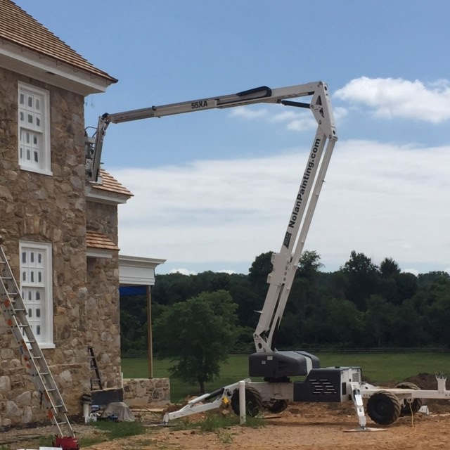 Nolan Painting Company- Havertown, PA crane to paint exterior of home