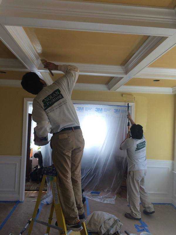 Nolan Painting Company- Havertown, PA employees painting walls and ceiling
